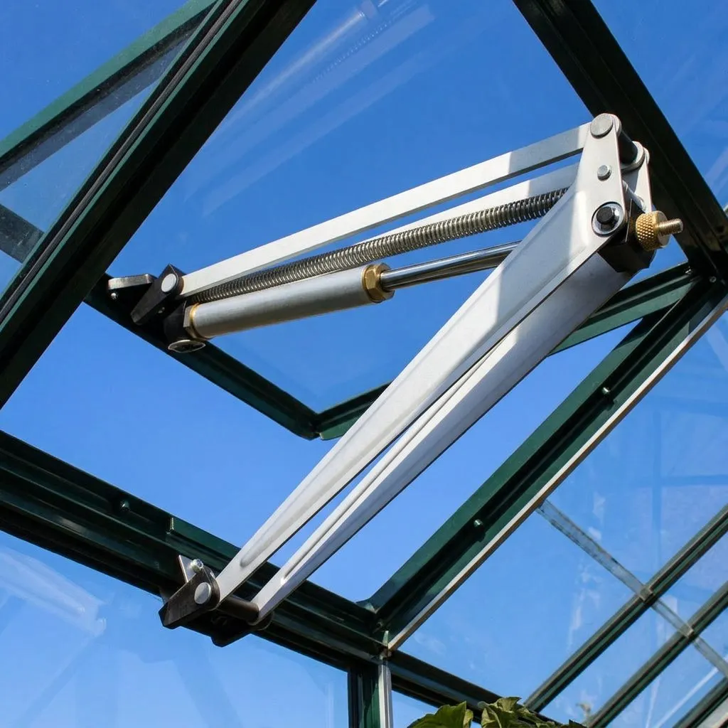 Automatic vent opener installed on a greenhouse roof vent